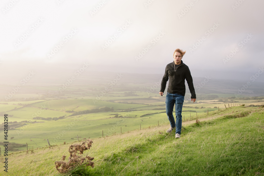 A man exploring a mountainside with a mazing views