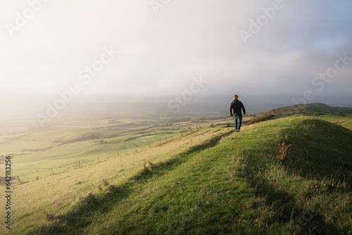 A man exploring a mountainside with a mazing views © harry