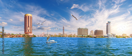 Obraz na płótnie View on the Nile with a sailboat, TV tower and the river bank, Cairo, Egypt w salonie