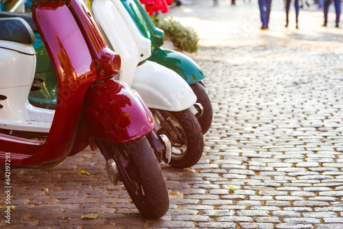 Canvas Print Italian style vintage scooter parked on sidewalk