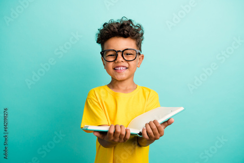 Canvastavla Portrait of smart small boy with brown hair wear stylish t-shirt in glasses hold