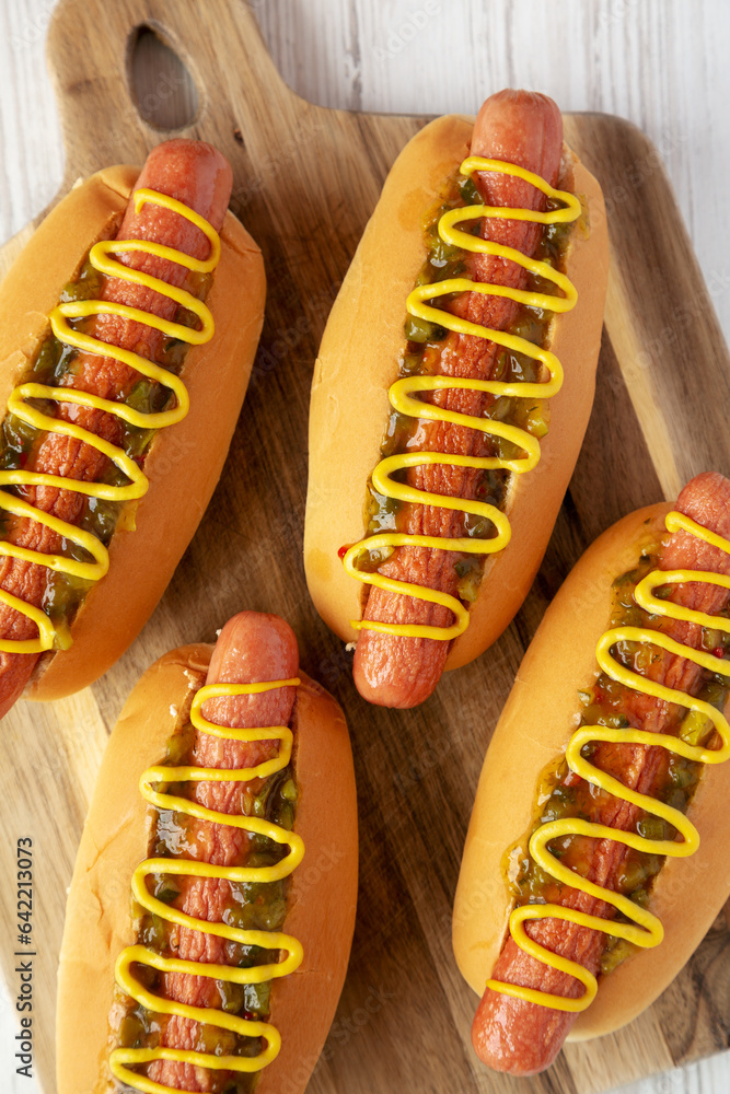 Homemade Gourmet Hot Dogs with Sweet Relish and Mustard, top view. Flat lay, overhead, from above. Homemade Gourmet Hot Dogs with Sweet Relish and Mustard, top view. Flat lay, overhead, from above.