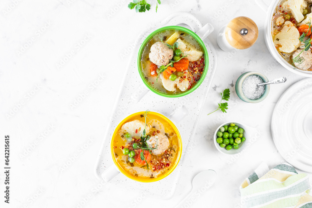 Spring bright soup with meatballs and vegetables. Copy space. Spring bright soup with meatballs and vegetables. Copy space.