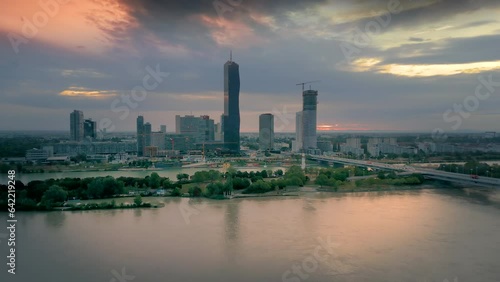 Vienna city skyline aerial view drone footage of vienna skyscrapers austria city river and bridge at sunset, vienna donau city photo