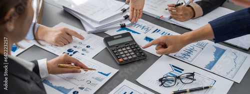 Auditor and accountant team working in office, analyze financial data and accounting record with calculator. Accounting company provide finance and taxation planning for profitable cash flow. Insight