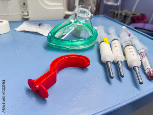 hospital tools: Airway masks ensure breath; intubation kit, laryngoscope aid in critical moments. Anesthesia brings healing serenity photo