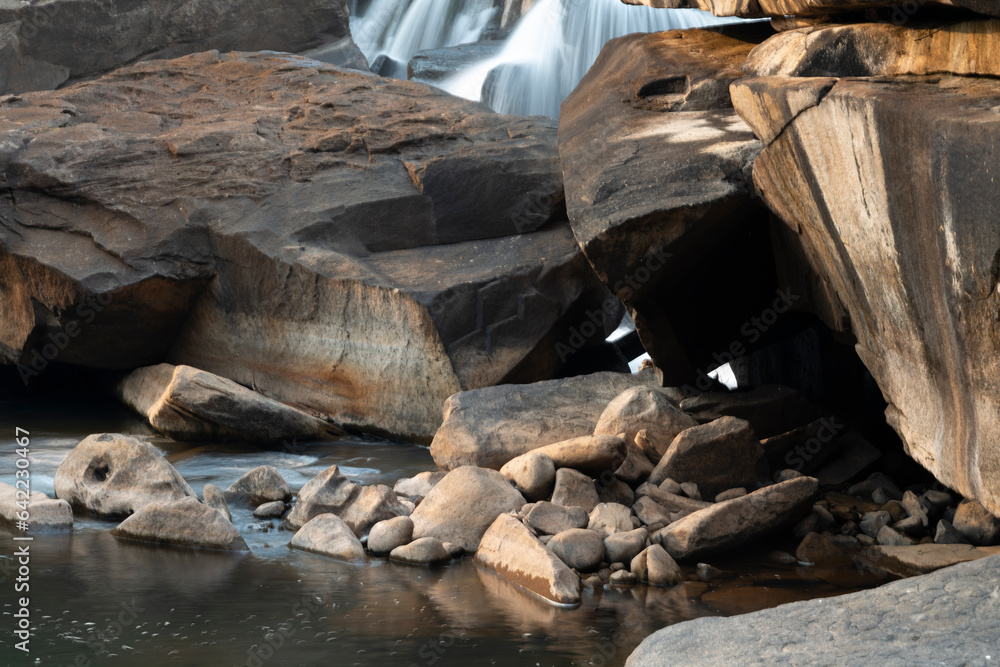 Maak Ngaew Waterfall rock pool,above cascades and rain forest, at sunset, near Pakse,Laos. Maak Ngaew Waterfall rock pool,above cascades and rain forest, at sunset, near Pakse,Laos.