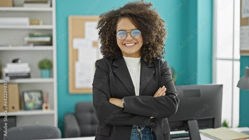 Young beautiful hispanic woman business worker smiling confident at the office Young beautiful hispanic woman business worker smiling confident at the office