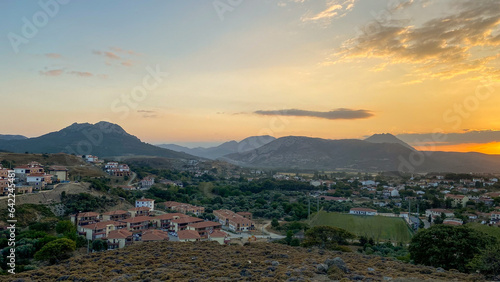 Gökceada, Imbros Island city center at sunset with buildings, Zeytinlikoy village, volcanic mountains view photo