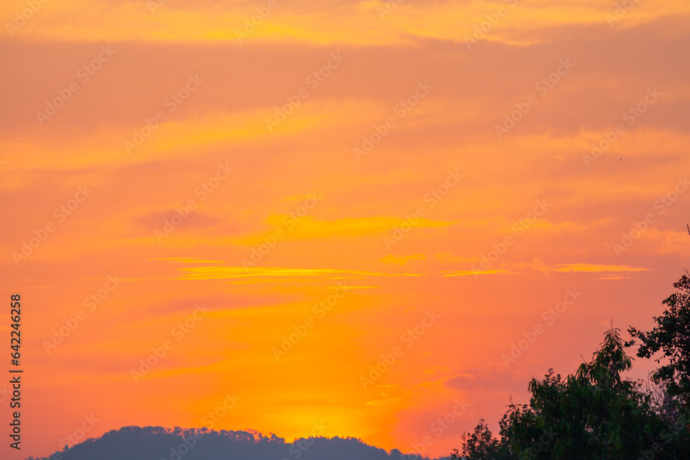 Amazing sky at sunset. Gradient color. Sky texture, abstract nature background..Sunset with red color light rays and other atmospheric effects..Big sunset and sweet lighting sky. phone antenna post.