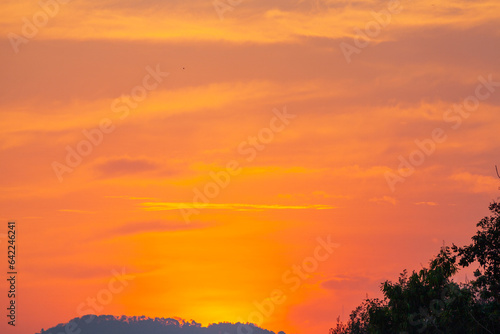Amazing sky at sunset. Gradient color. Sky texture  abstract nature background..Sunset with red color light rays and other atmospheric effects..Big sunset and sweet lighting sky. phone antenna post.