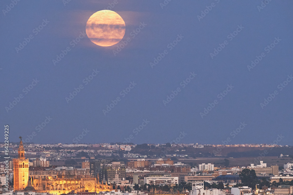 Celestial Elegance: Giralda Tower and the Supermoon Over Seville
