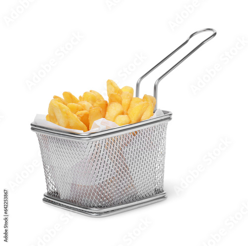 Delicious French fries in metal basket isolated on white photo