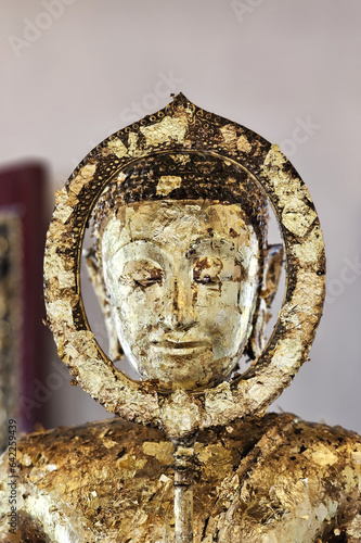 Ancient Golden Buddha Image at Wat Rakhang Kositaram Woramahawihan Temple, Bangkok Thailand.