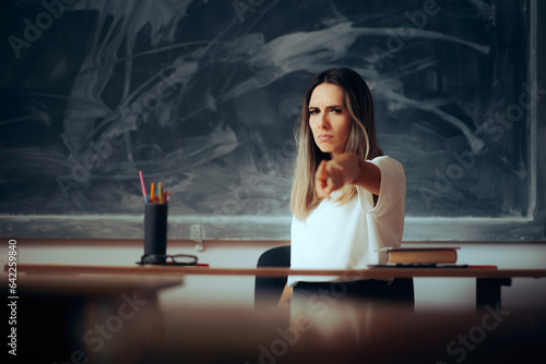 Angry Teacher Pointing to the Classroom During Scolding Students. Upset female professor feeling furious and strict 
 photo