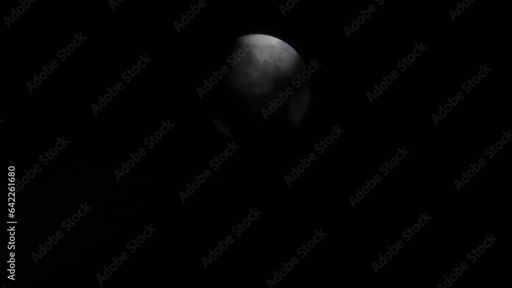 Time lapse of the moon in the bright night sky Time lapse of the moon in the bright night sky