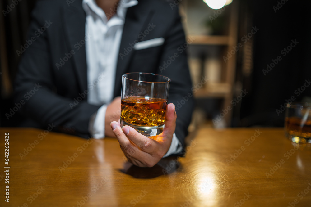 Businessmen in suits drinking whiskey Businessmen in suits drinking whiskey