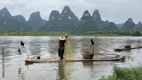 Cormorant Fisherman Ready preparing to Fish on the Li River in Guilin China