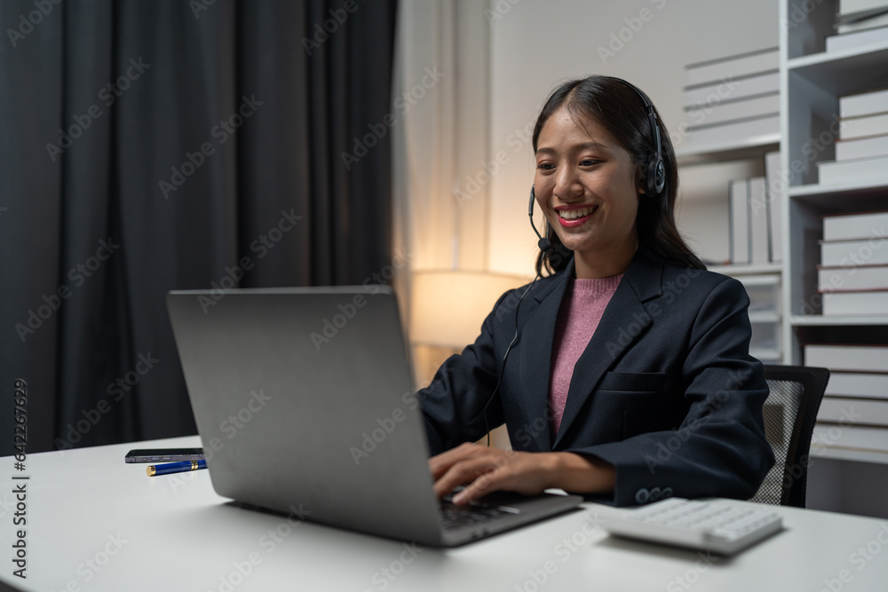 Asia call center with headset and microphone working on laptop Female entrepreneurs serving customers, business information, inquiries Support call center representatives help customers. Asia call center with headset and microphone working on laptop Female entrepreneurs serving customers, business information, inquiries Support call center representatives help customers.