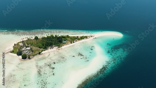 Tropical island Sibuan with sandy beach and coral reef. Tun Sakaran Marine Park. Borneo, Sabah, Malaysia. photo