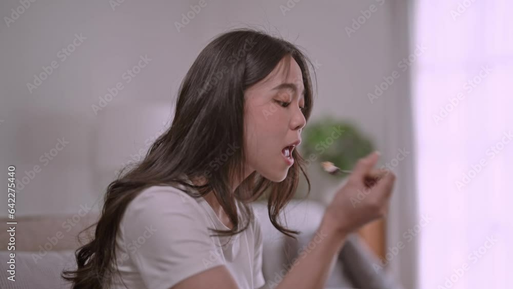 Healthy Young Asian woman Drinking milk from a glass enjoy with nutrition wellness life at home. Healthy Young Asian woman Drinking milk from a glass enjoy with nutrition wellness life at home.
