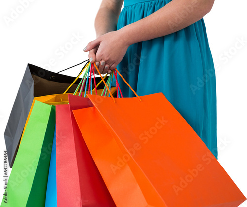 Digital png photo of caucasian woman holding colourful shopping bags on transparent background