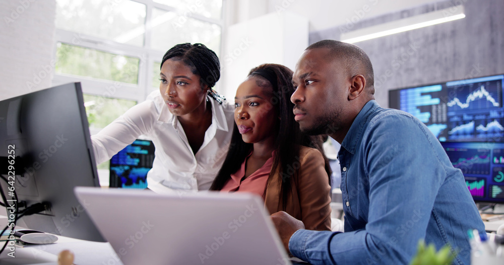 African Financial Data Analysts Using Dashboard On Screens