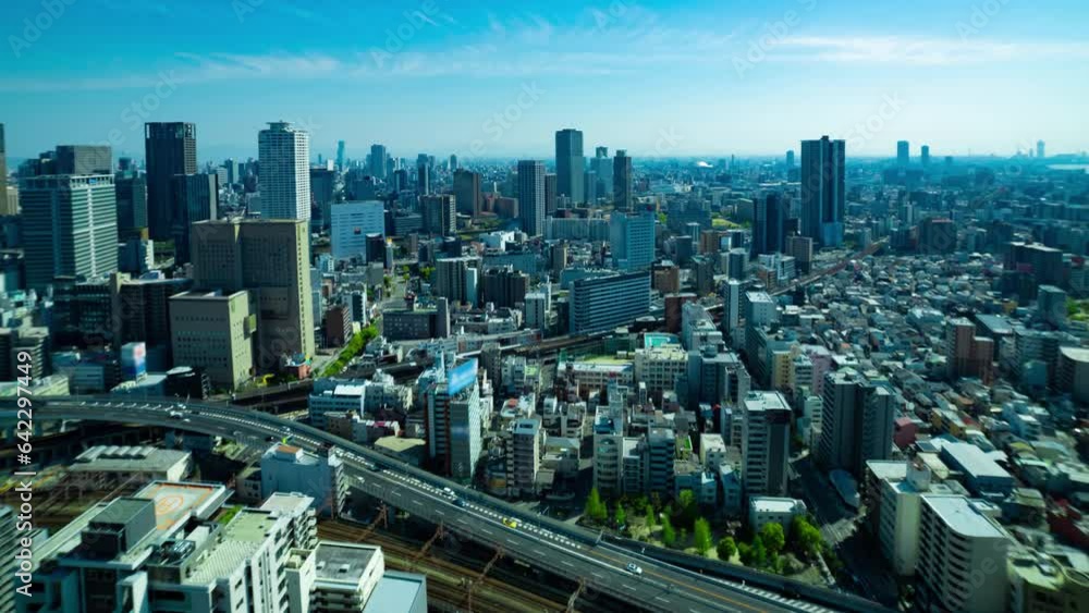 A timelapse of panorama cityscape near the railway in Osaka wide shot panning A timelapse of panorama cityscape near the railway in Osaka wide shot panning