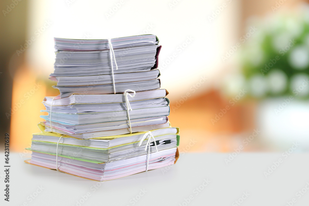 Pile or heap of financial business document paperwork stack on office desk concept of workload overtime or workplace paperless copy - obrazy, fototapety, plakaty 
