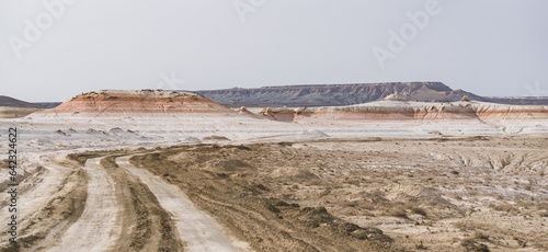 Multi-colored hills, mountains and cliffs in the Kazakh steppe, layered mountains made of chalk and limestone photo