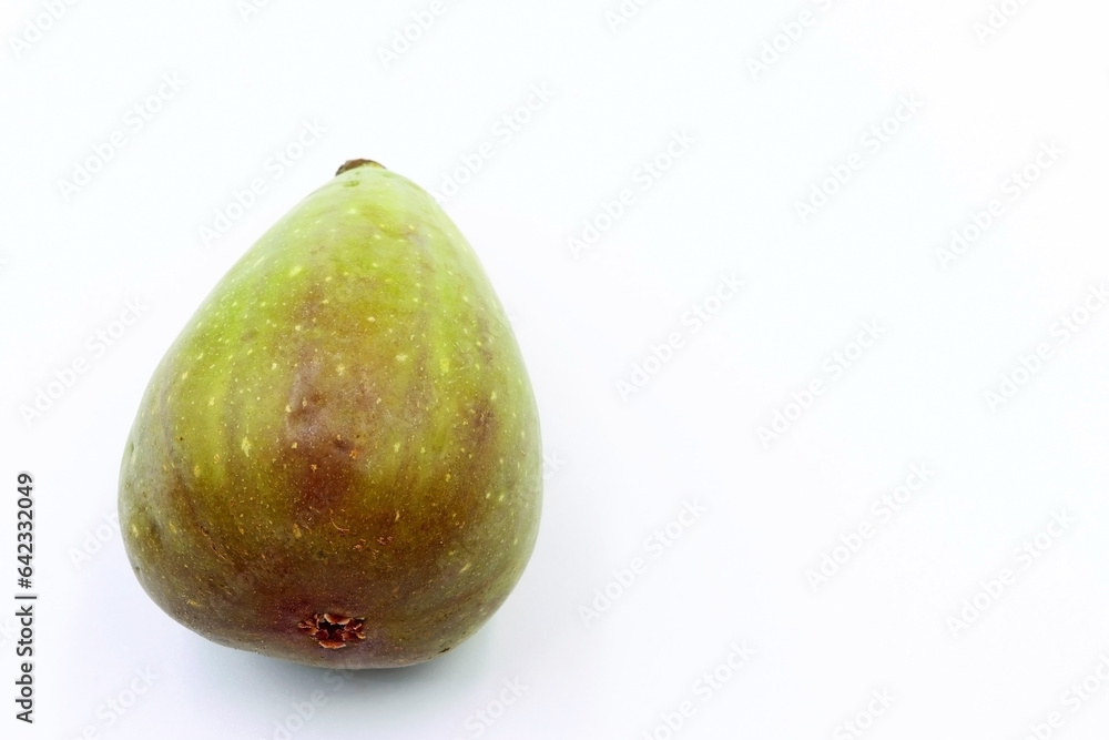 A fig on a white background. Concept of healthy and natural food A fig on a white background. Concept of healthy and natural food