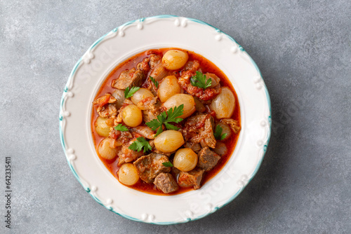 Traditional Greek dish of beef stifado in a sauce. Meat stew, onion stew. Turkish name; sogan yahni or et yahni photo