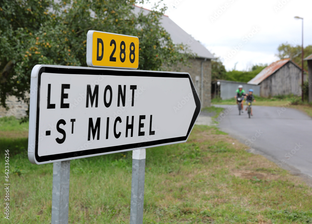Arrow with text to go to Mont Saint Michel Abbey in France ON THE ROAD