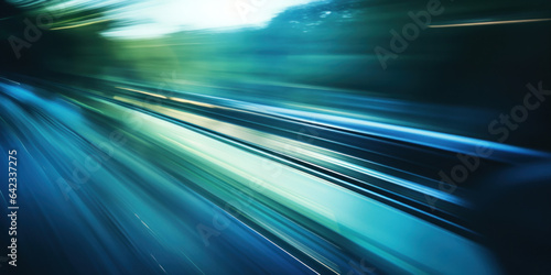 Сlose-up photograph looking out of the front window of the car onto the road ahead, showing acceleration and speed. Stylized with blur and action. Blue, green colors