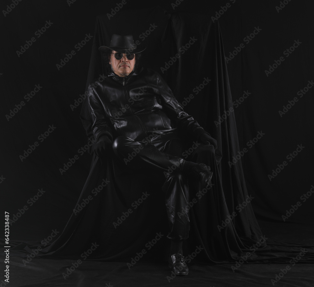 portrait of a cowboy in a black leather jacket on a black background portrait of a cowboy in a black leather jacket on a black background