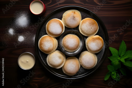 Mini poffertjes, Dutch pancakes served on a platter, top down