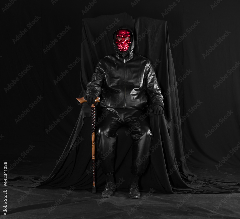 portrait of a man in a monster mask on a black background portrait of a man in a monster mask on a black background