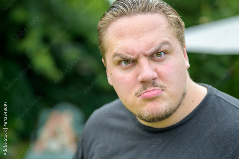 Young man in his twenties looking very aggressive Young man in his twenties looking very aggressive