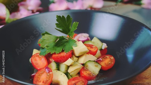 Vegetable salad on a plate. Close-up shot of table. Cooking in the kitchen. photo