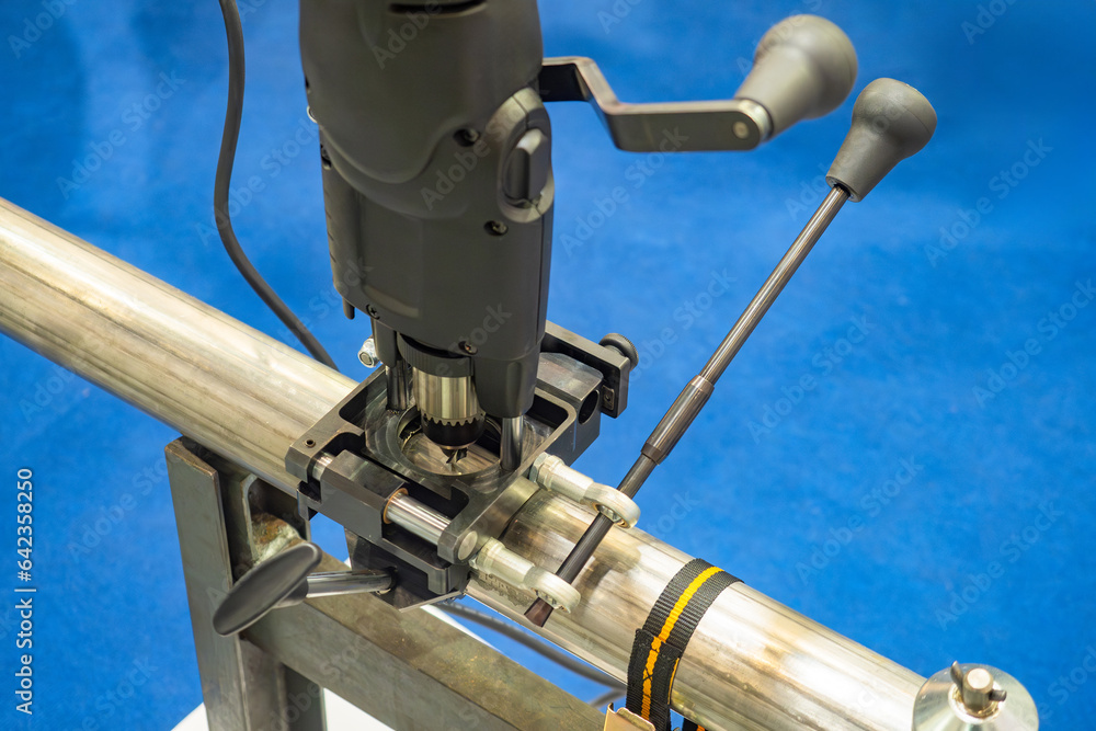 Drilling machine for pipes. Process of creating hole in pipeline. Connections of two pipes. Drilling equipment for pipeline production. Drilling hole in metal pipe. Pipeline production Drilling machine for pipes. Process of creating hole in pipeline. Connections of two pipes. Drilling equipment for pipeline production. Drilling hole in metal pipe. Pipeline production