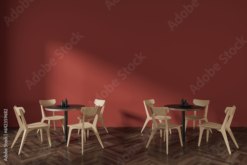 Orange cafe interior with round tables