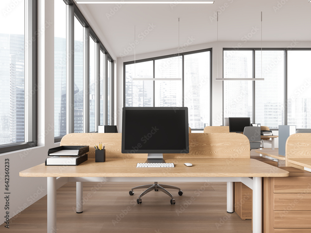 Modern coworking interior with workspace, desk and pc screen, panoramic window Modern coworking interior with workspace, desk and pc screen, panoramic window
