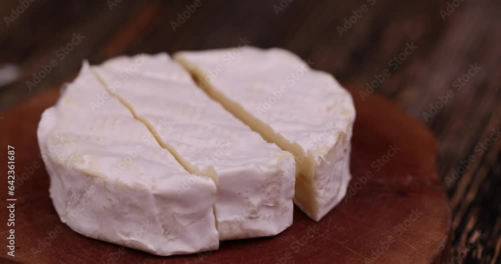 soft cream cheese with white mold, delicious white cheese sliced on a board soft cream cheese with white mold, delicious white cheese sliced on a board