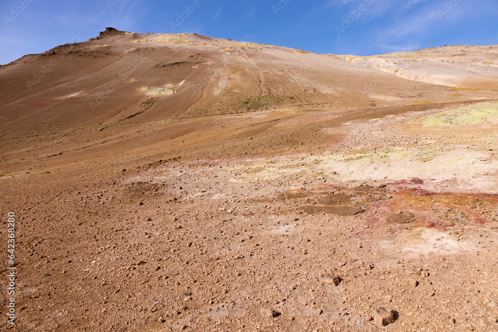 Hverir, Iceland. A surreal, bare orangy-red, geothermal area at the foot of Namafjall. Full of fumaroles, mud pools, steam vents. It's on Route 1. It is also called Namaskard Hverir. Hverir, Iceland. A surreal, bare orangy-red, geothermal area at the foot of Namafjall. Full of fumaroles, mud pools, steam vents. It's on Route 1. It is also called Namaskard Hverir.