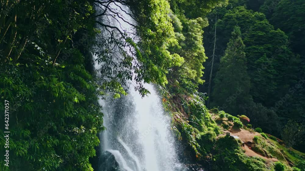 Woodland waterfall falling rocks closeup. Drone shot vivid water cascading mossy Woodland waterfall falling rocks closeup. Drone shot vivid water cascading mossy