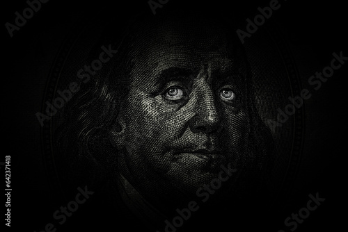 Ben Franklin's face with glowing eyes on the old US $100 dollar bill. Macro grunge style photo. Large resolution, large size, high quality. photo