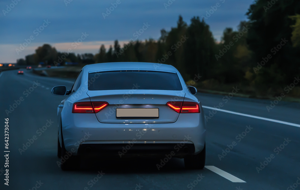 Car moves on highway at night