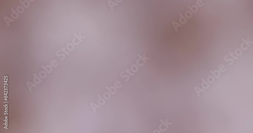 slow-moving abstract purple background, unfocused video shooting of a purple object photo