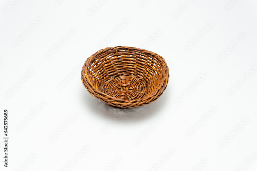 Fototapeta premium wicker basket isolated on white. Empty wooden fruit or bread basket isolated on white background