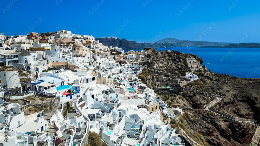 Oia Santorini Greece aerial drone view with blue sea and clear sky